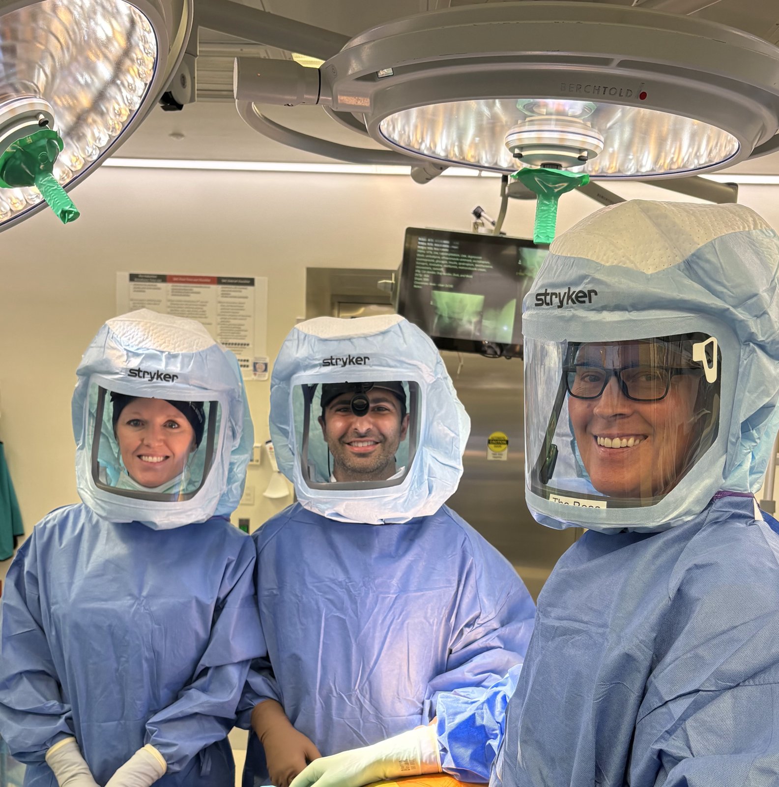 Dr. Matar and colleagues in surgical hoods in the operating room