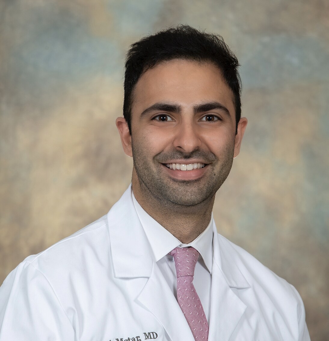 Portrait of Dr. Robert Matar in a white coat
