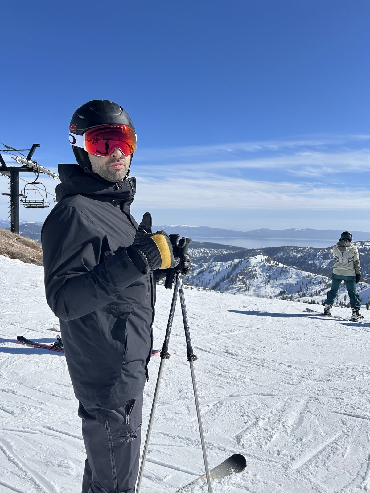 Dr. Matar skiing on a sunny mountain ridge